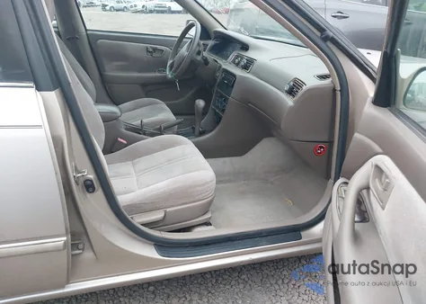 1997 Toyota Camry Le z USA, uszkodzony, nr VIN 4T1BG22KXVU084418